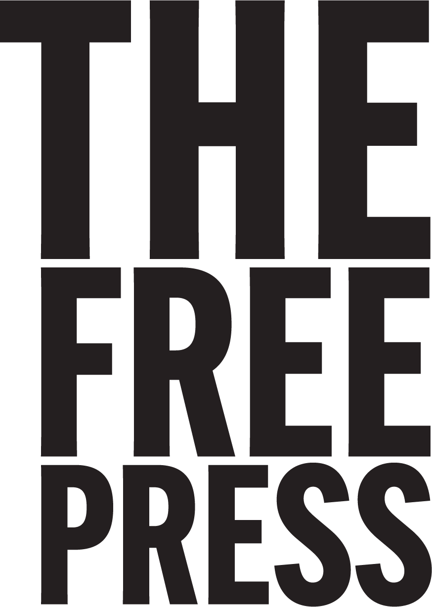 Black background with bold white text that reads "the free press." the text is large and covers the entire image, emphasizing the importance of a free press.
